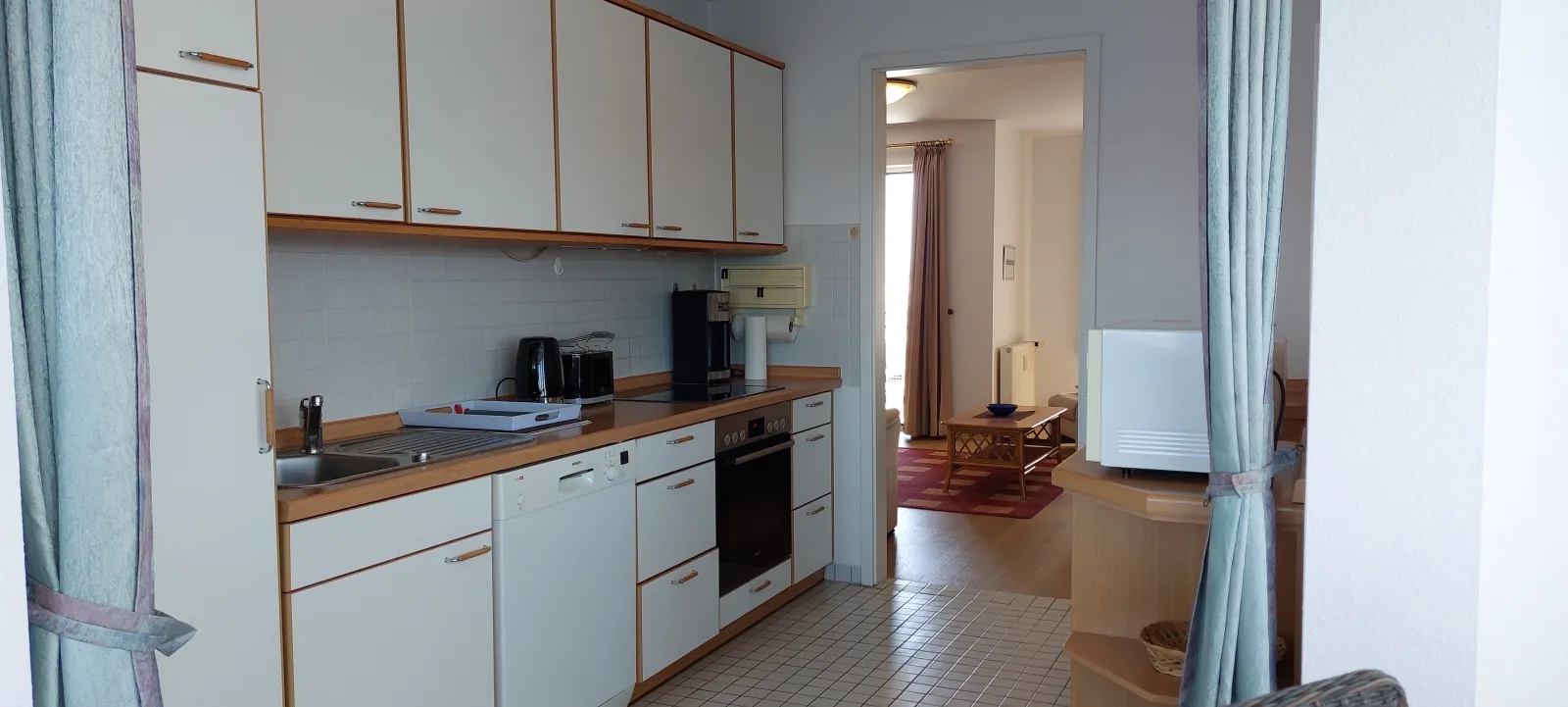 Exklusive Ferienwohnung am Südstrand mit Wintergarten, Balkon & Meerblick | Wohnung 22