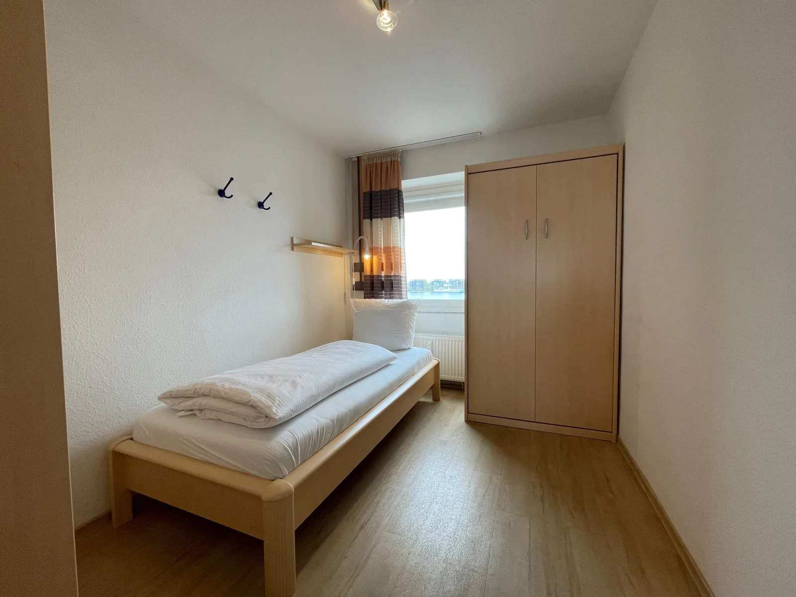 Exklusive Ferienwohnung am Südstrand mit Wintergarten, Balkon & Meerblick | Wohnung 22