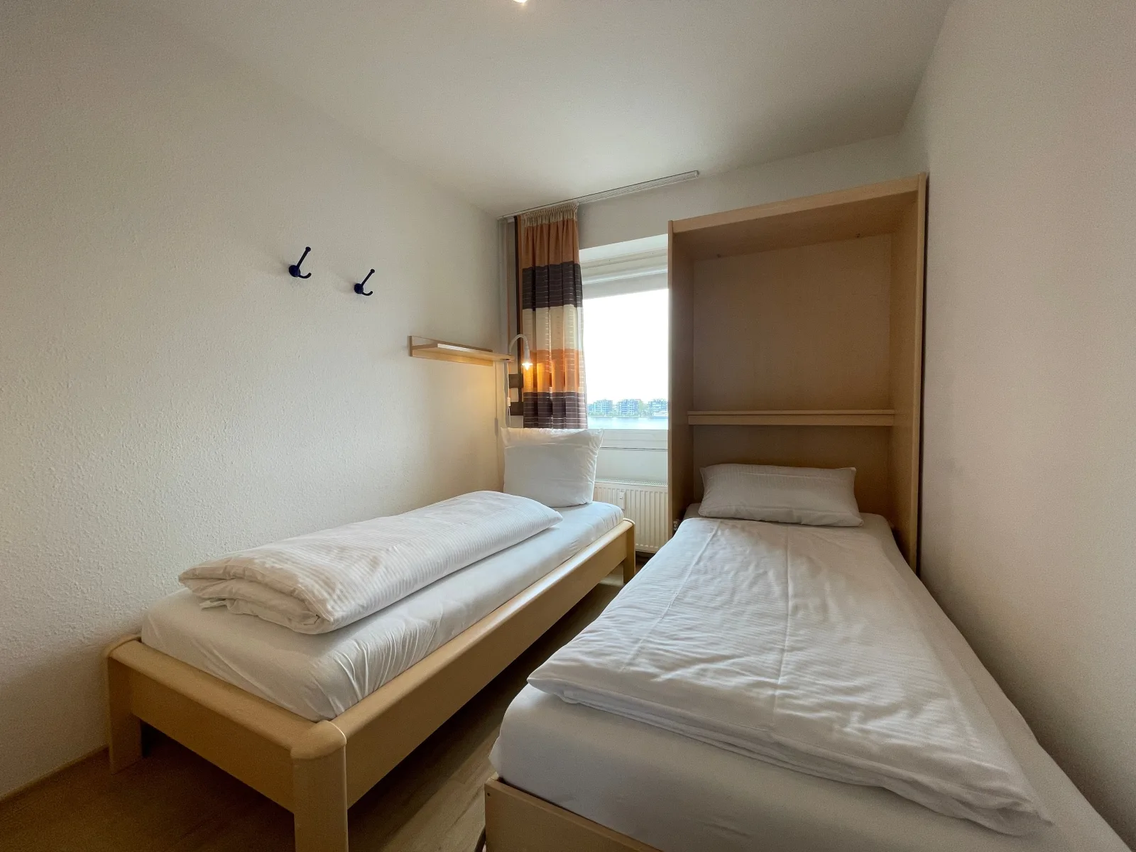 Exklusive Ferienwohnung am Südstrand mit Wintergarten, Balkon & Meerblick | Wohnung 22