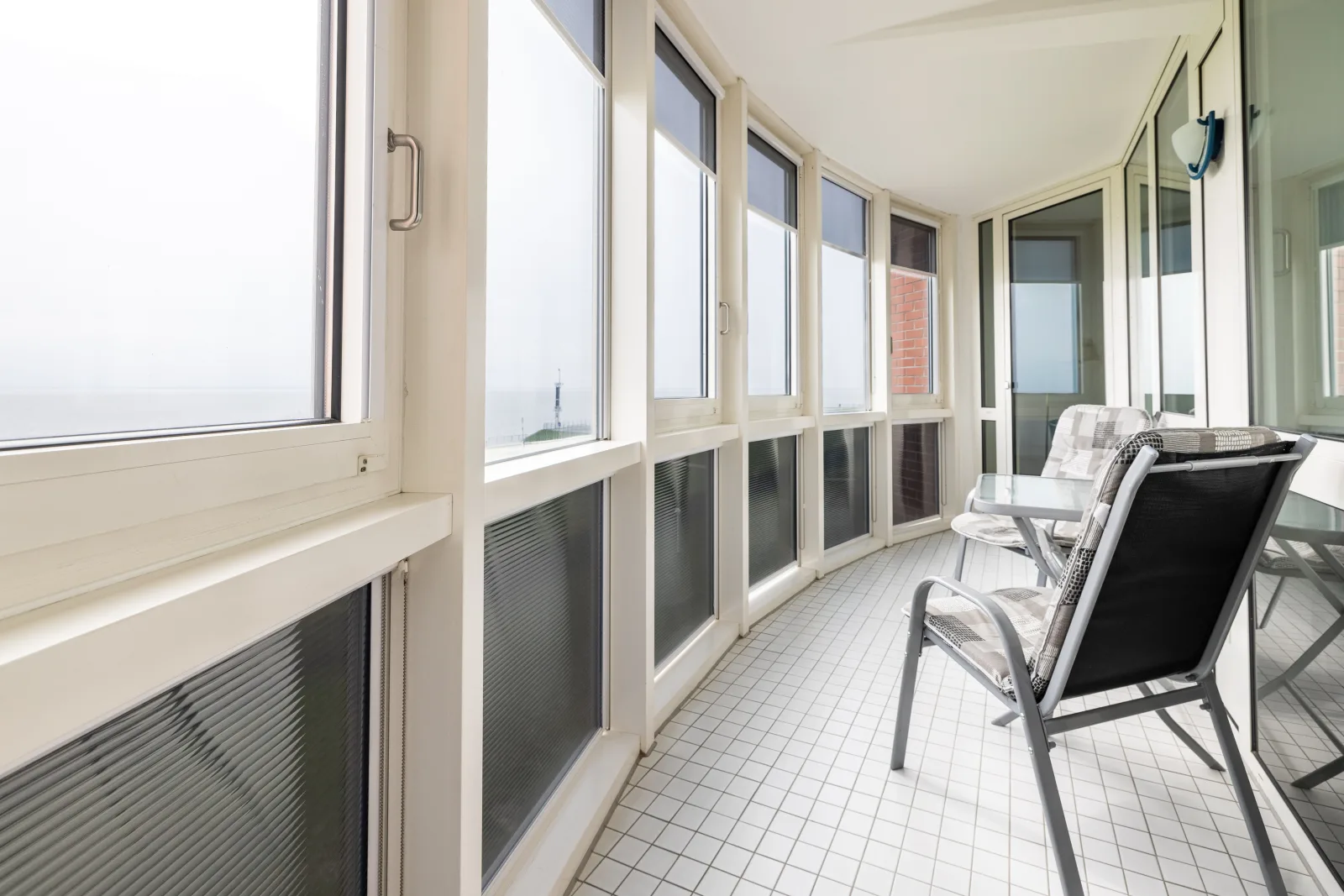Gemütliche Ferienwohnung mit Wintergarten & Meerblick am Südstrand | Wohnung 123