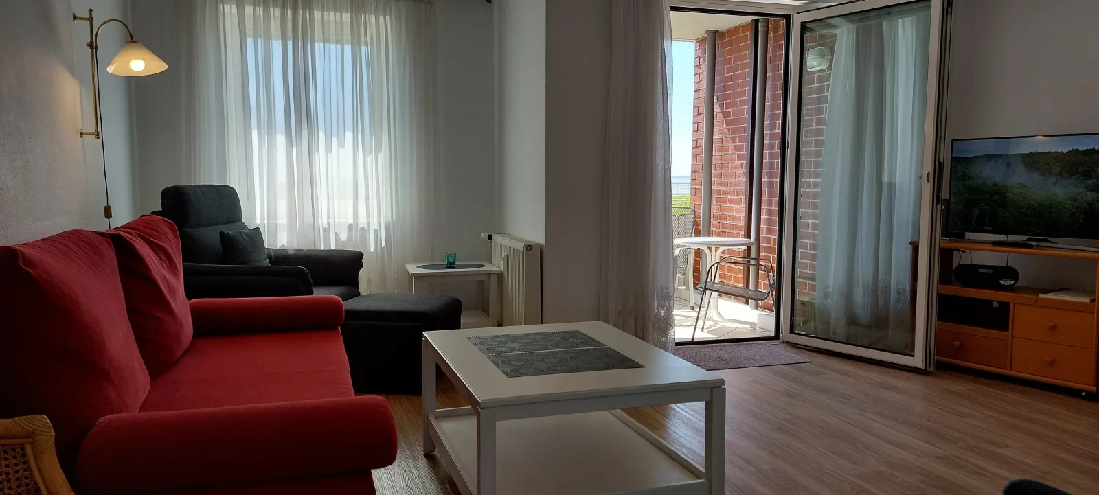 Exklusive Ferienwohnung am Südstrand mit Wintergarten & Hafenblick | Wohnung 113