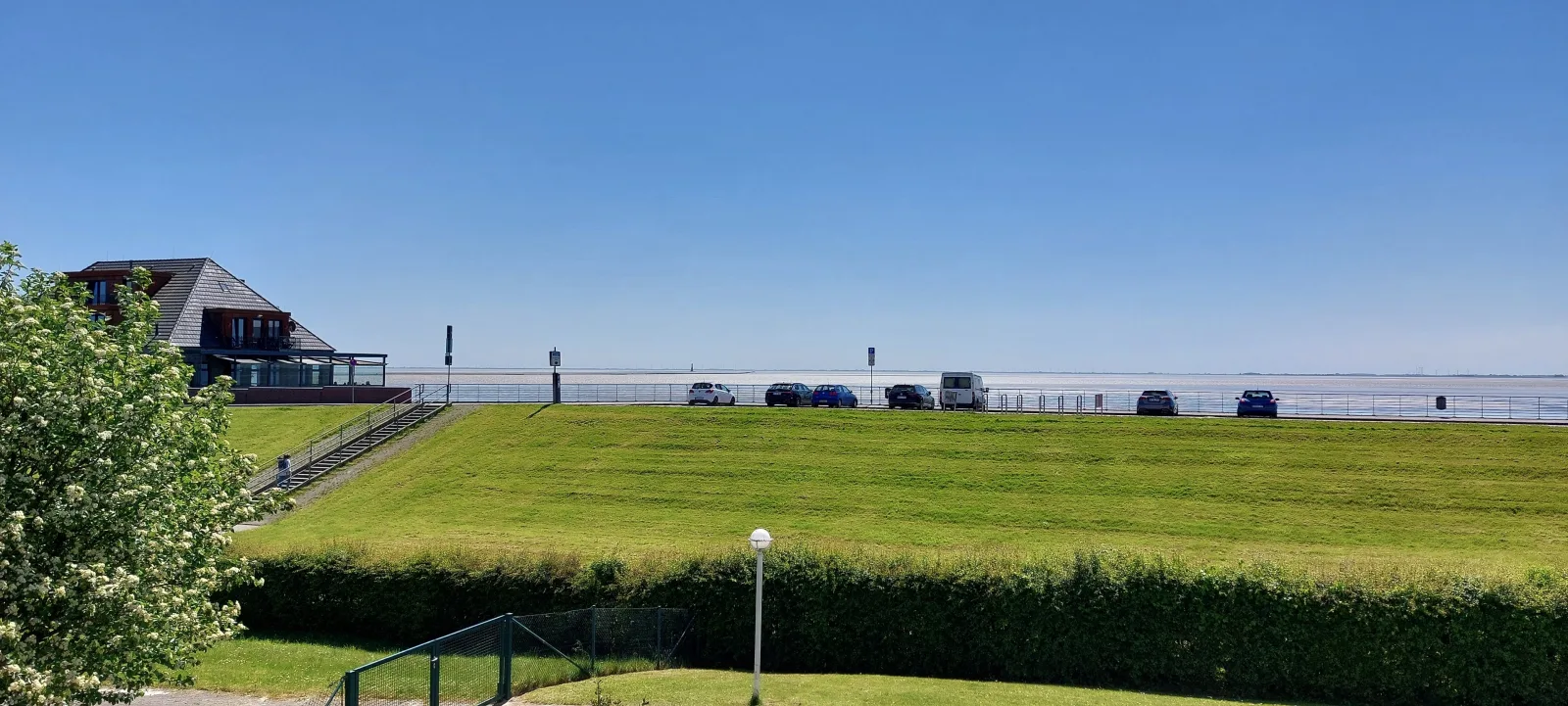 Exklusive Ferienwohnung am Südstrand mit Wintergarten & Hafenblick | Wohnung 113
