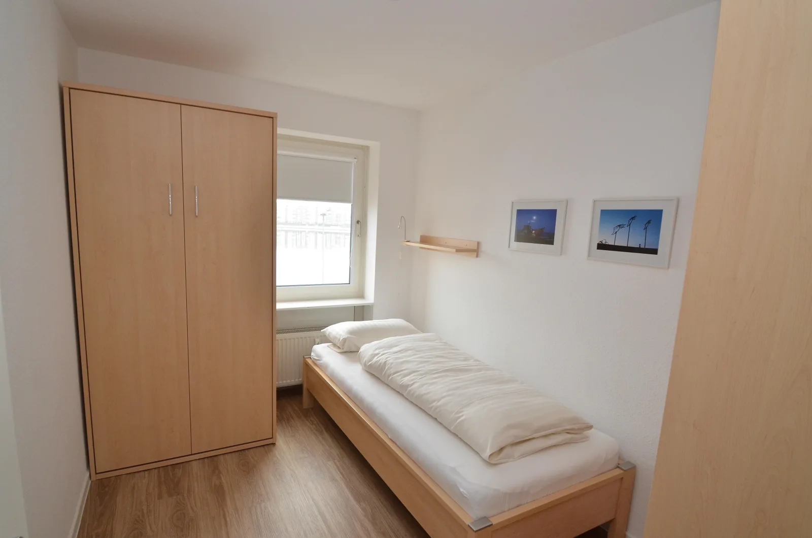 Exklusive Ferienwohnung am Südstrand mit Wintergarten & Hafenblick | Wohnung 113