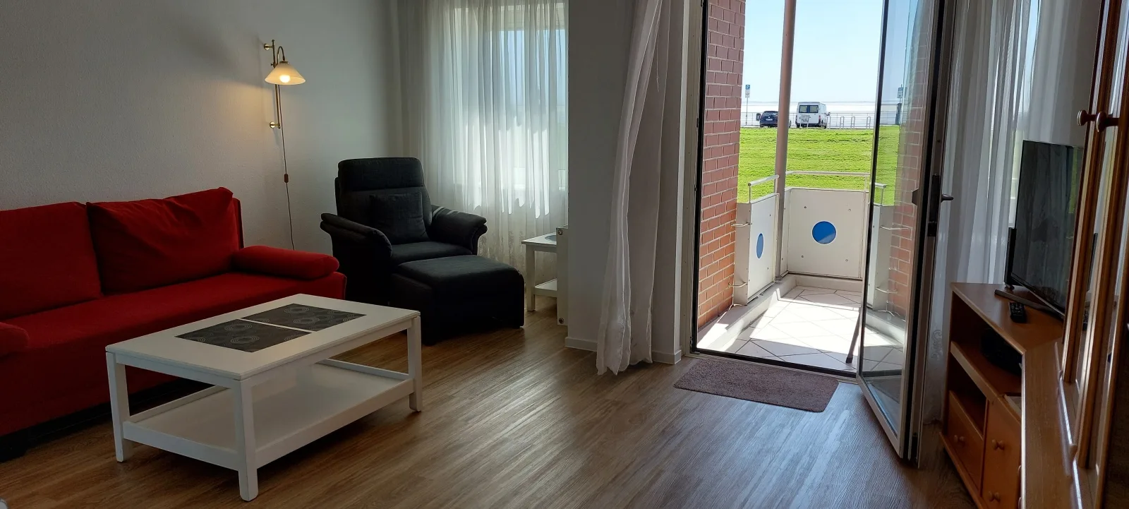 Exklusive Ferienwohnung am Südstrand mit Wintergarten & Hafenblick | Wohnung 113