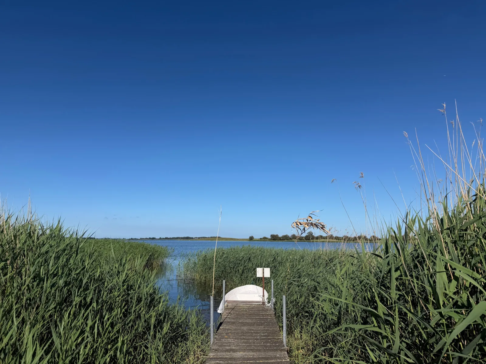 Ferienwohnung - Rügenbrise mit Seeblick mit 3 Bädern, Steg und Paddelboot - alle inklusive